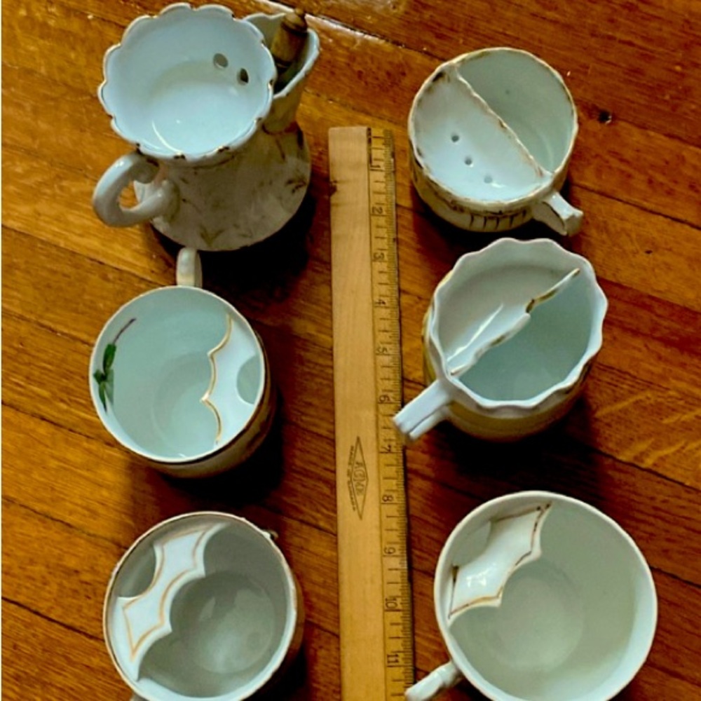 Antique moustache and shaving mugs. One with original shaving brush